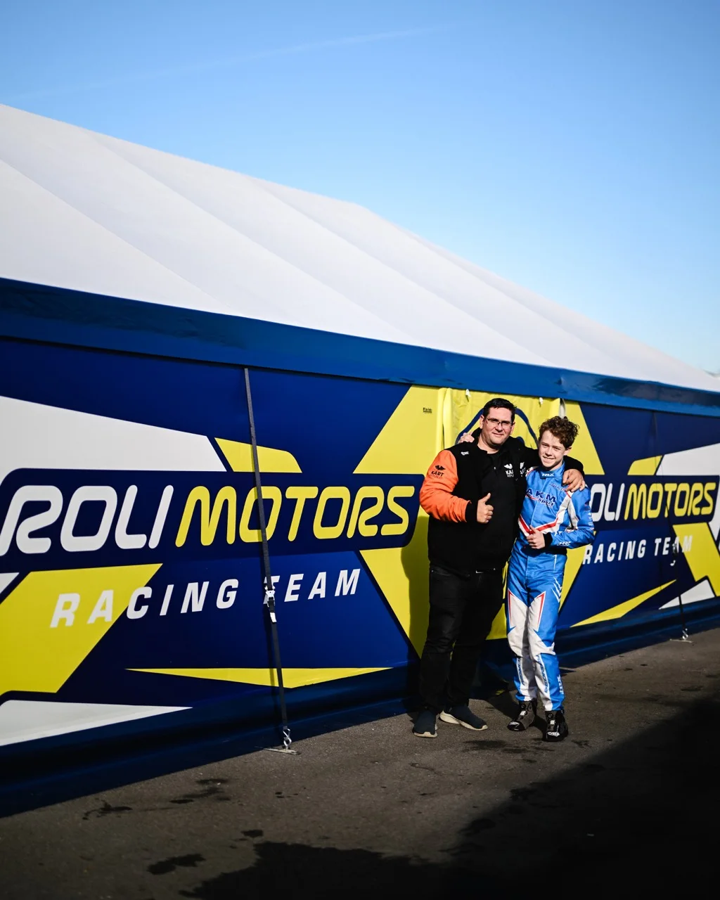 Andrei Bersenev and a driver at an FIA karting event